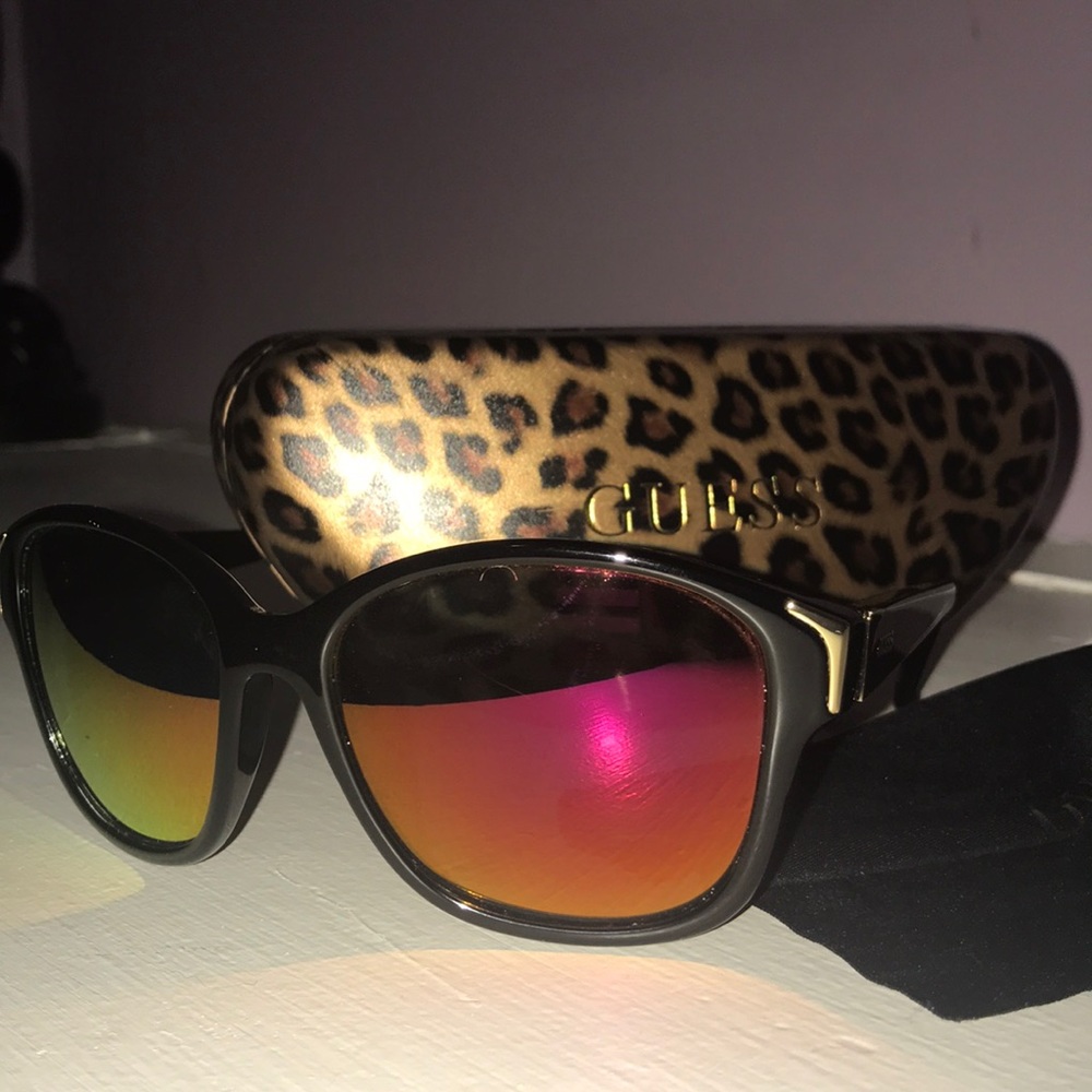 Guess sunglasses with red/orange lenses.